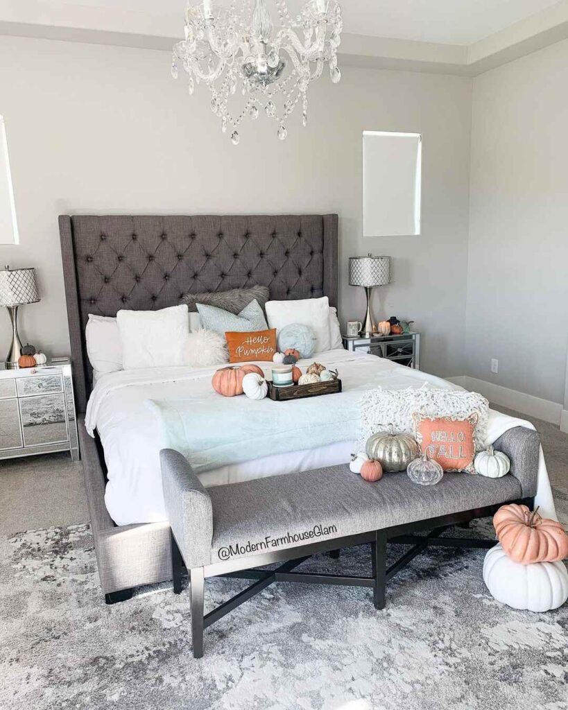  Elegant bedroom with fall decor and pumpkins