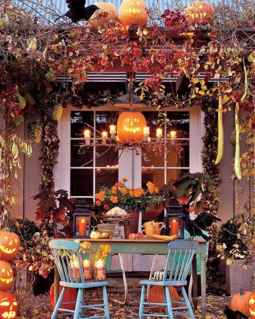 Autumn porch with pumpkins, foliage, lights