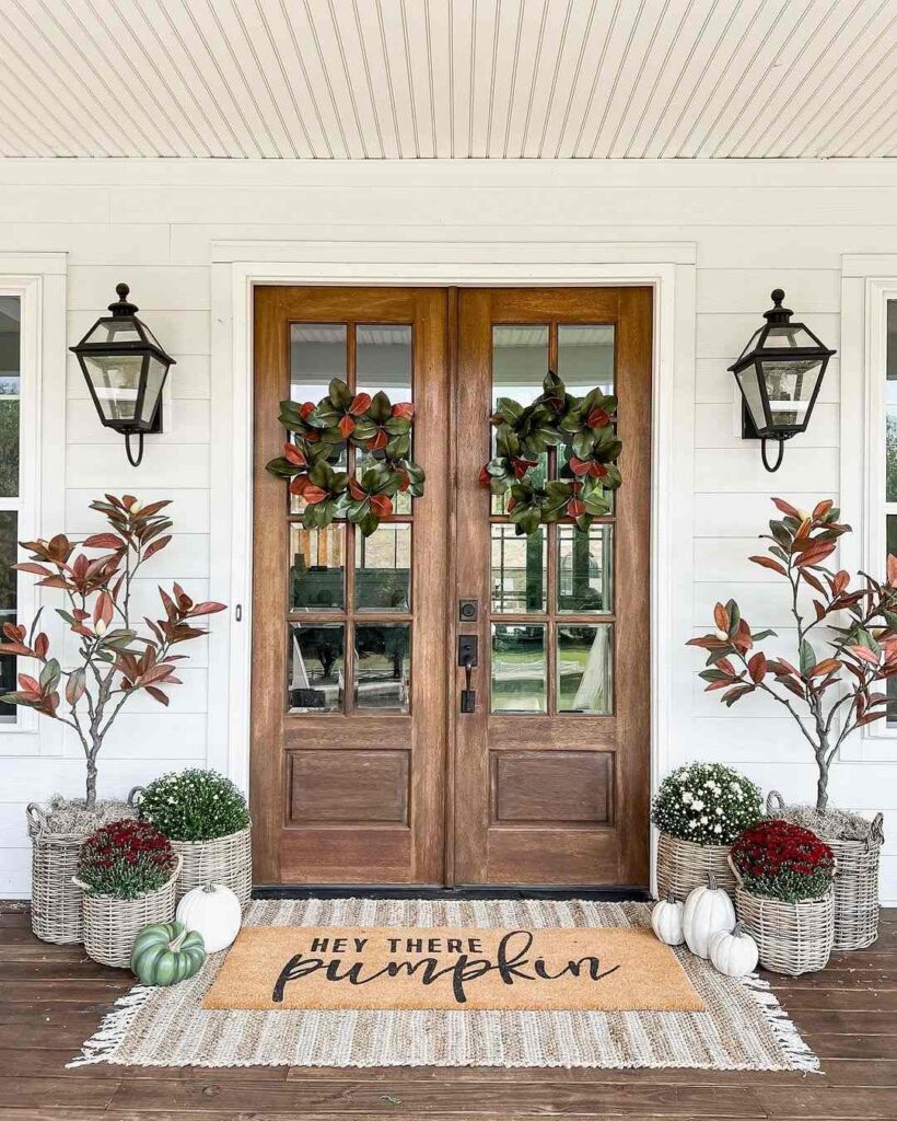 Fall-decorated porch with wreaths and pumpkins