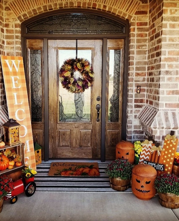 Festive porch, wreath, pumpkins, welcome sign