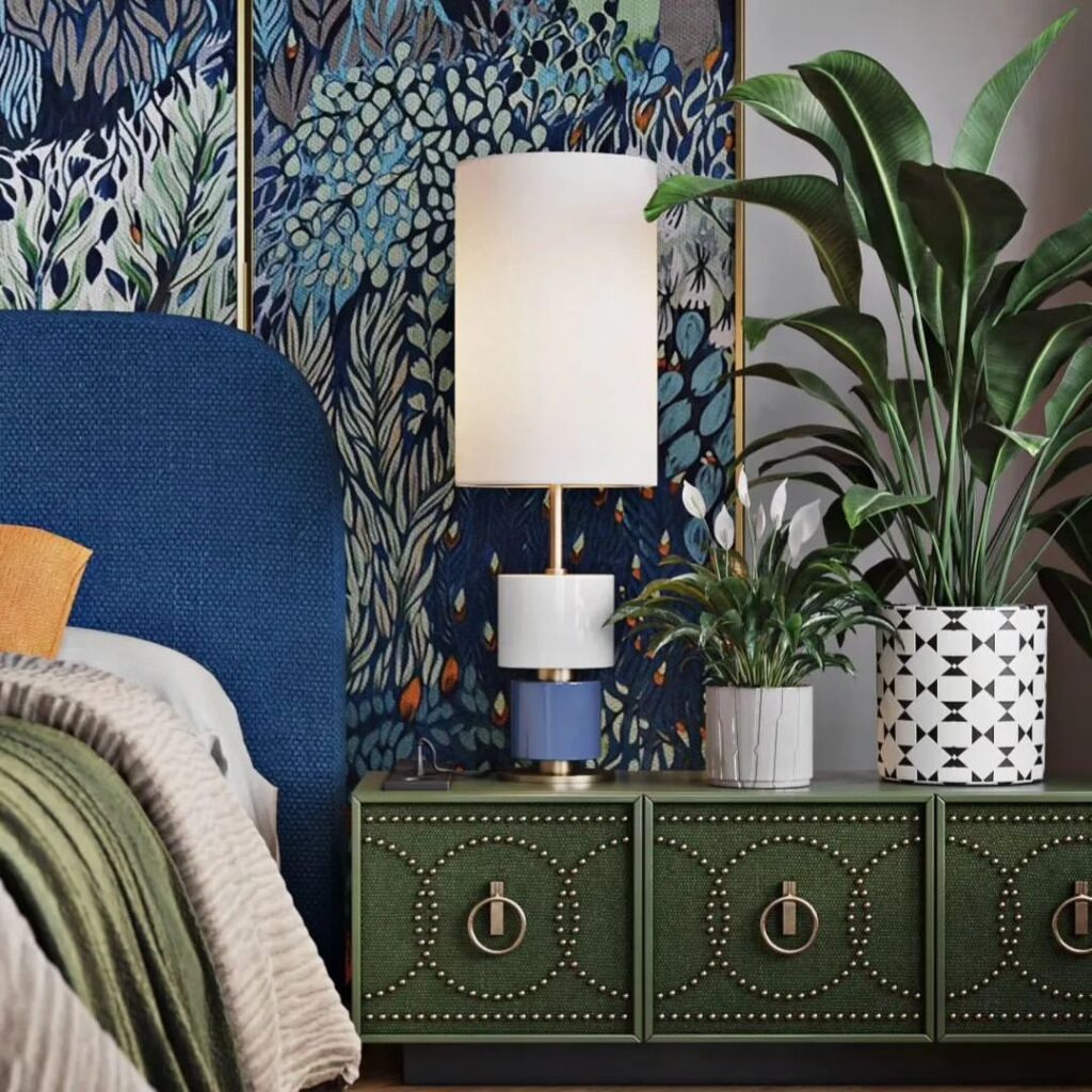 Blue floral wallpaper, navy headboard, botanical accents