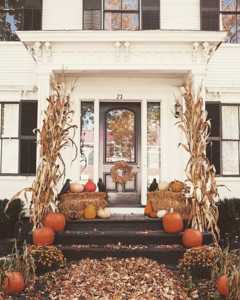 Pumpkins, cornstalks, hay bales, autumn porch