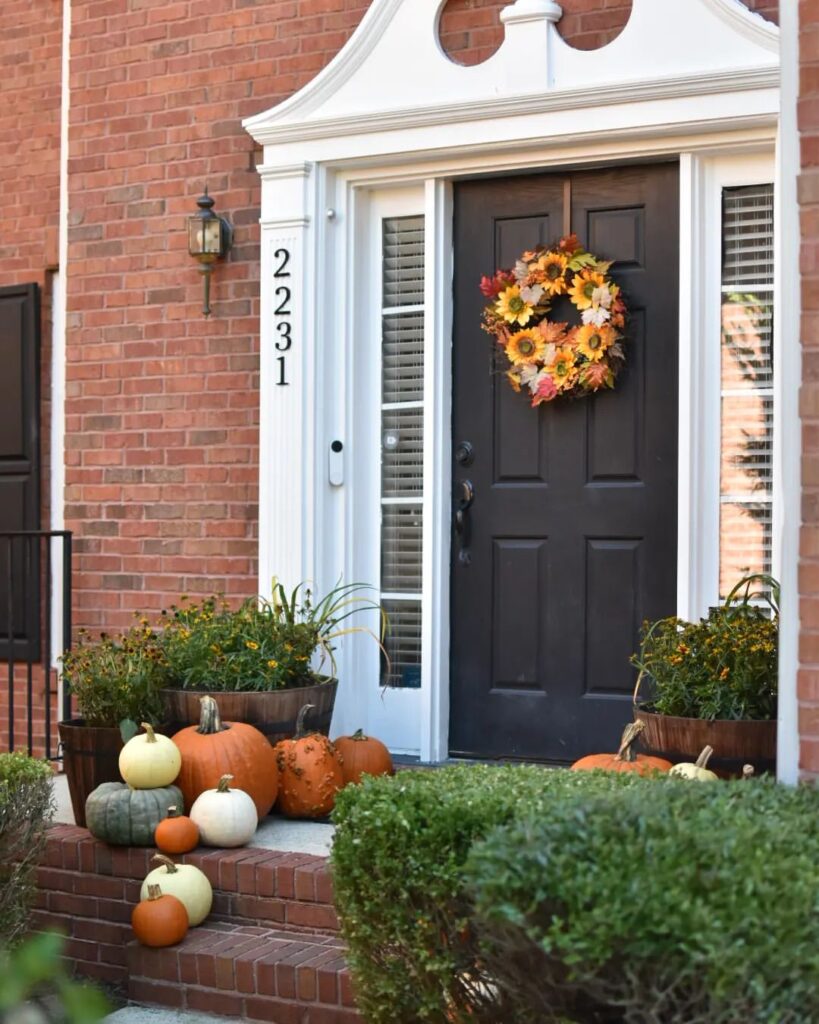 Fall porch, pumpkins, wreath, brick steps