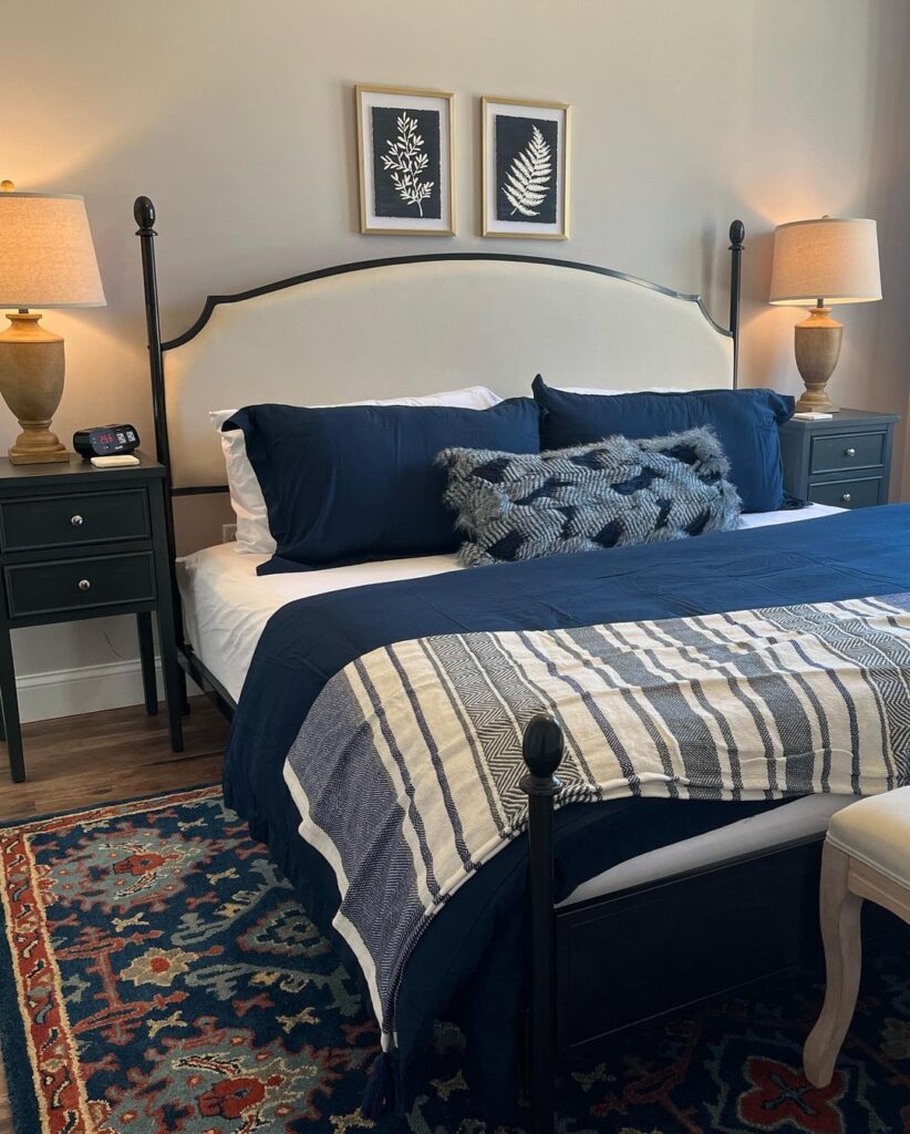 Navy and cream bedroom with botanical art