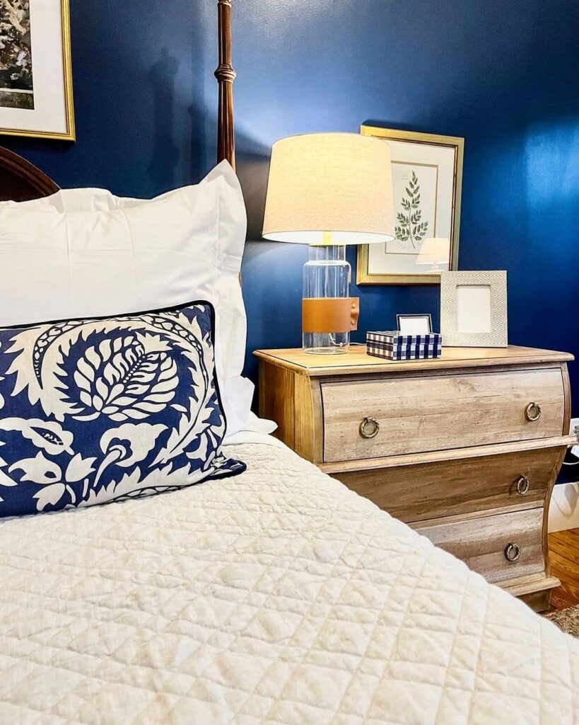 Navy blue bedroom with cream accents