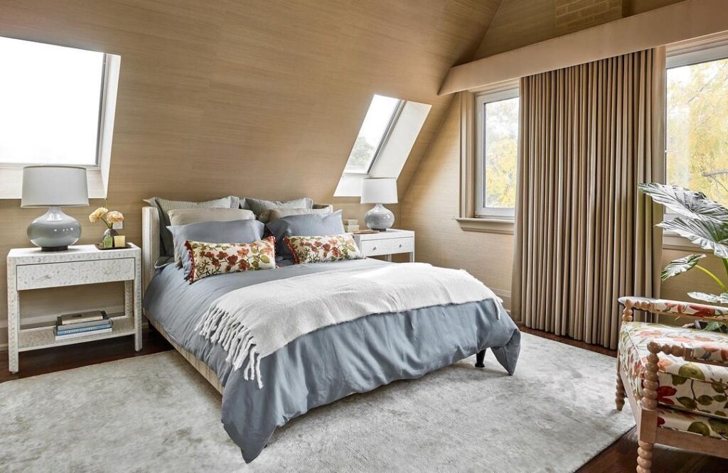 Attic bedroom with skylights and floral accents