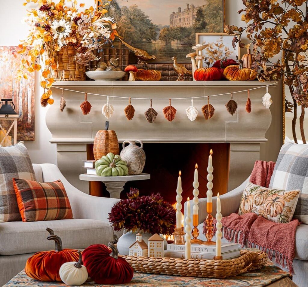 Fall-themed fireplace, pumpkins, candles, plaid decor