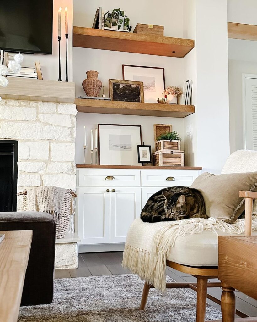 Rustic shelves with fall decor, cozy chair