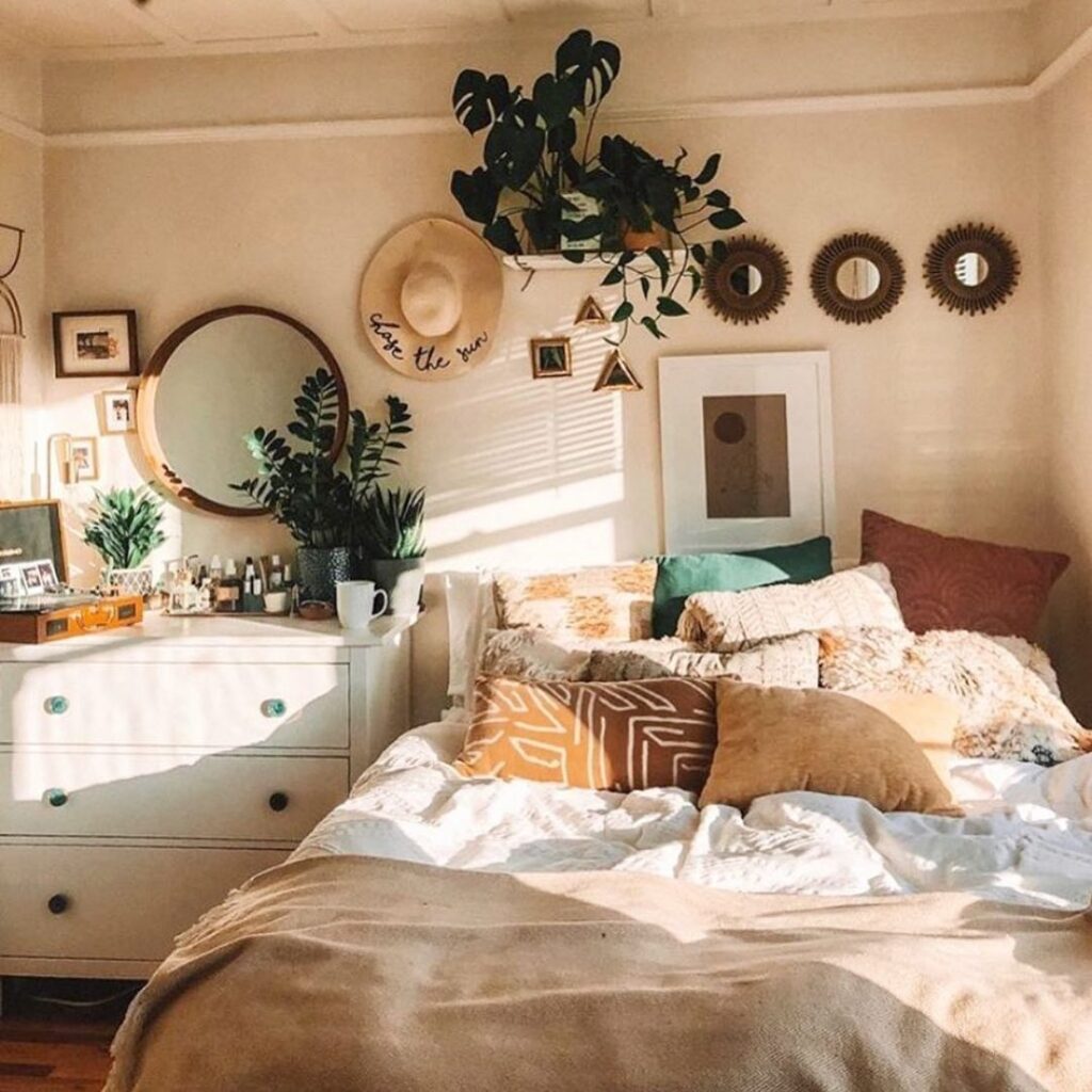 Bohemian bedroom with plants, mirrors, cozy bedding