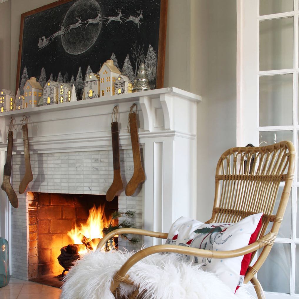 Village houses, chalkboard art, fireplace, cozy chair