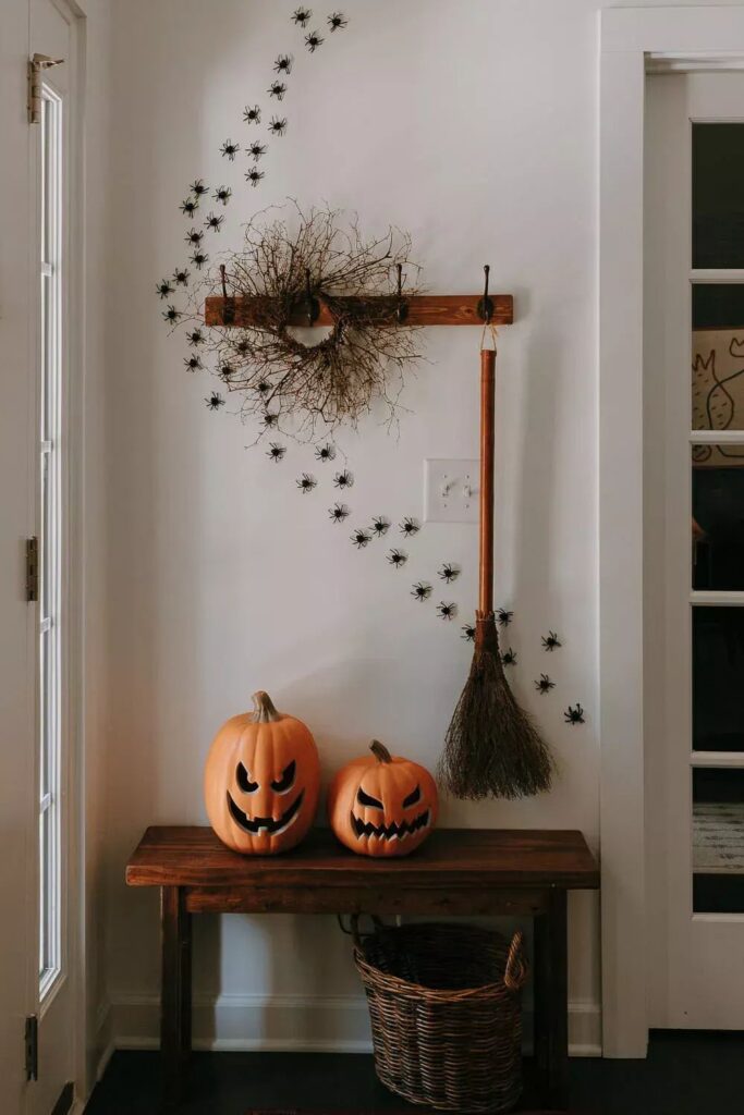 Halloween entryway with spiders and pumpkins