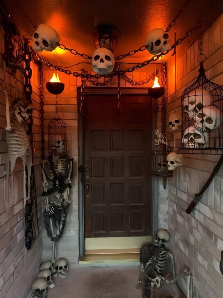 Spooky Halloween entryway with skeletons and skulls