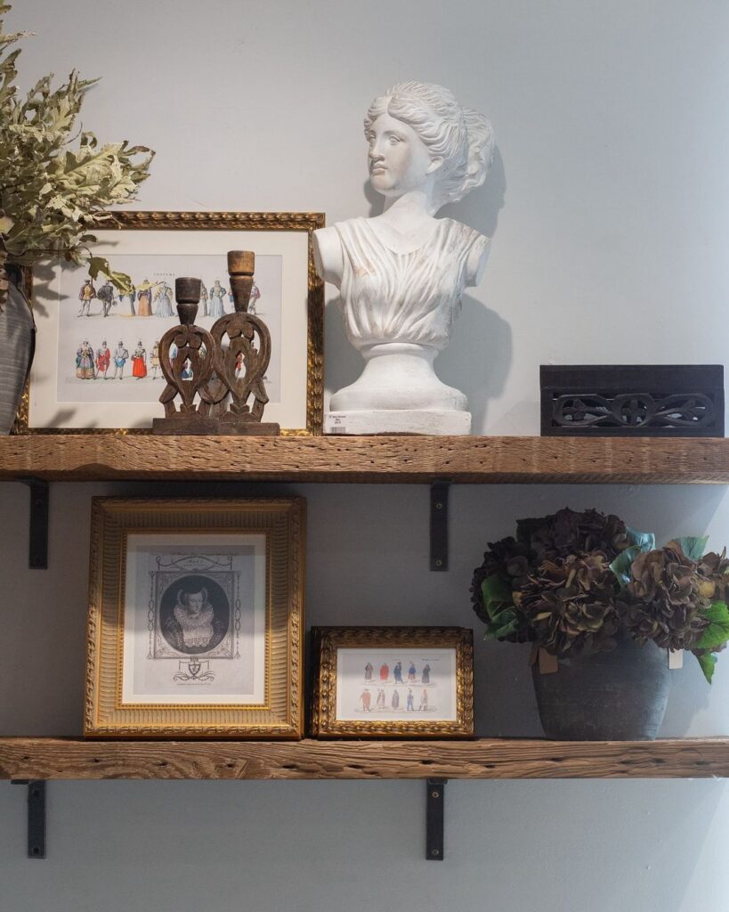 Rustic shelves, classical bust, vintage prints