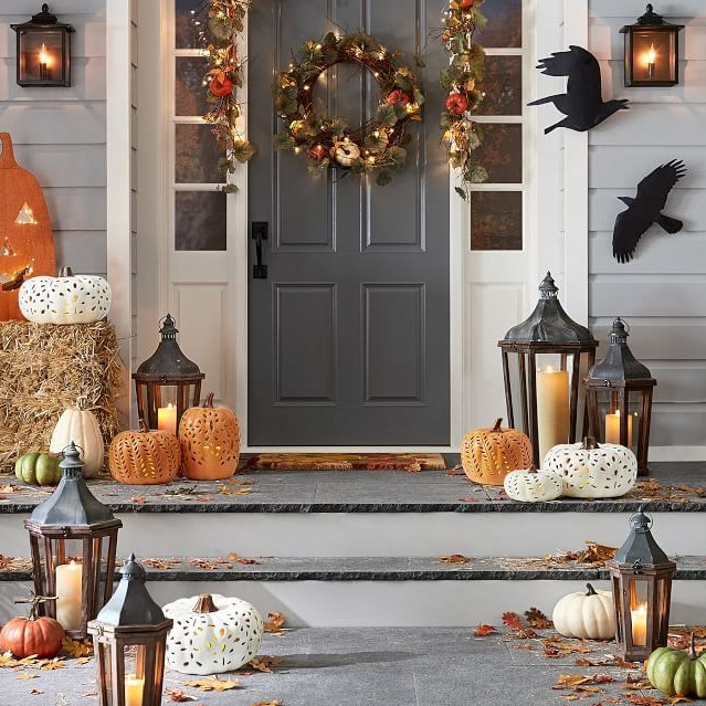 Illuminated wreath, pumpkins, lanterns, autumn porch