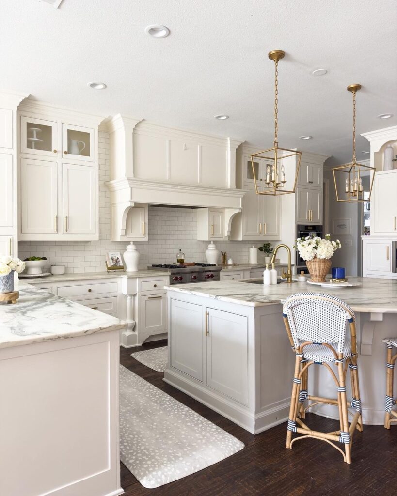 White kitchen, gold accents, coastal stools