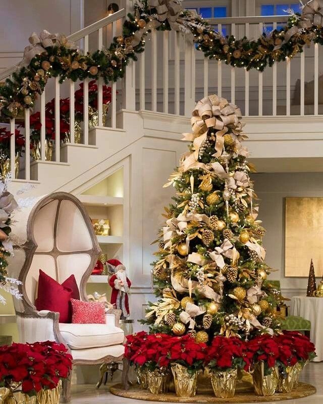 Ornate Christmas tree and decorated staircase garland