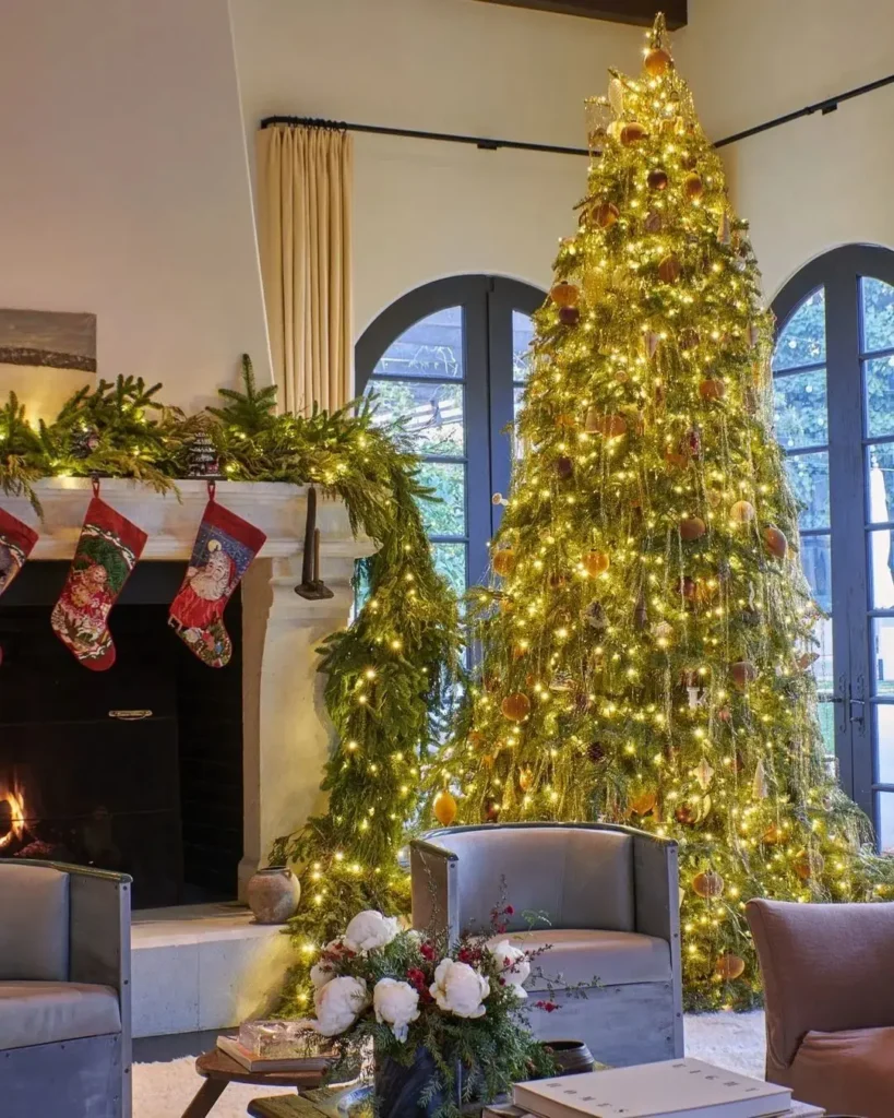 Lit mantel, golden tree, elegant decor