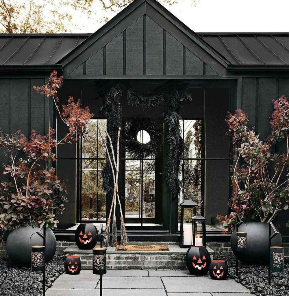 Dark porch, black pumpkins, gothic Halloween decor