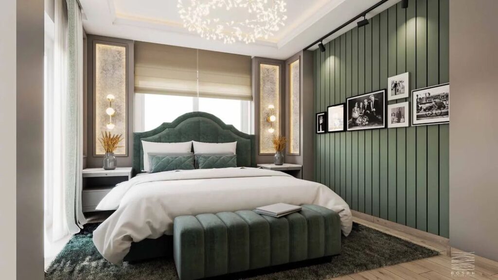 Green velvet headboard, paneled wall, circular chandelier