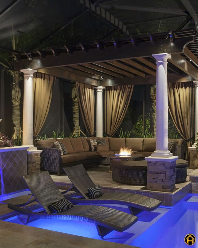 Pergola, fire pit, wicker furniture, blue lighting