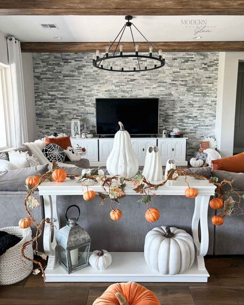 Halloween-decorated living room with pumpkins and ghosts