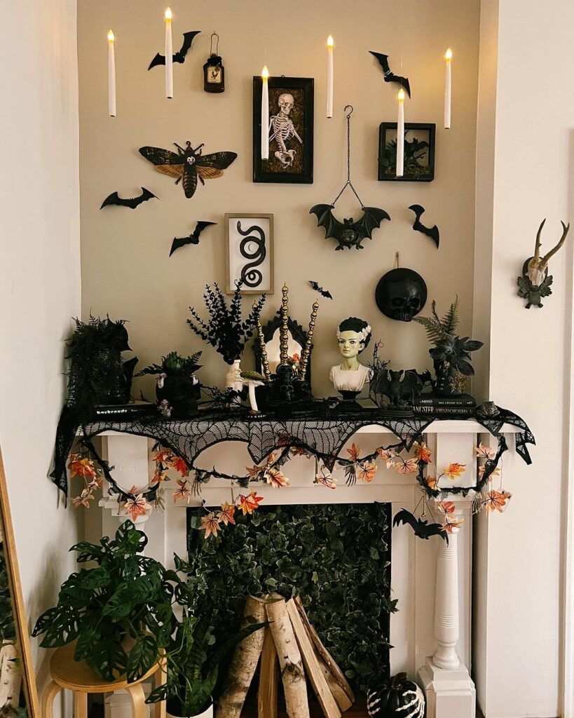 Gothic Halloween mantel with plants and spooky decor