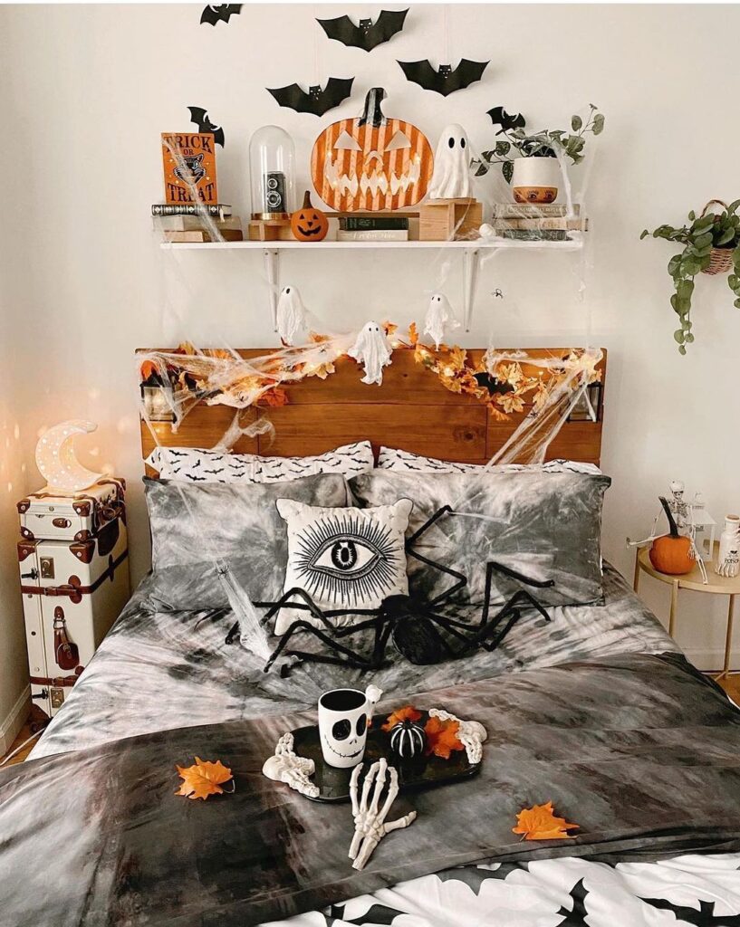 Halloween bedroom with spooky decor and pumpkins