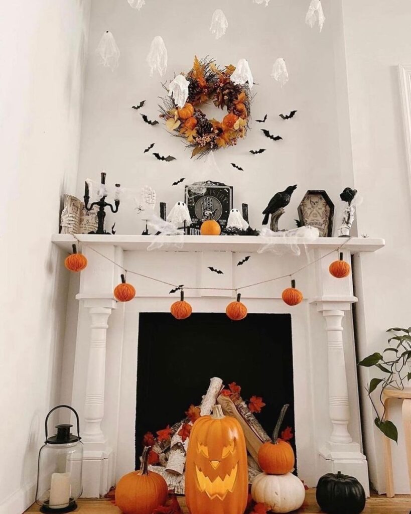 Halloween-themed fireplace with pumpkins and ghosts