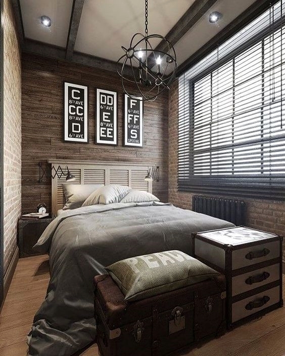 Dark wood industrial bedroom with trunk