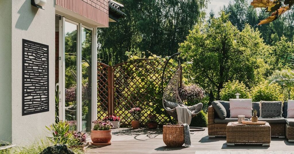 Patio with lattice fence and wicker furniture