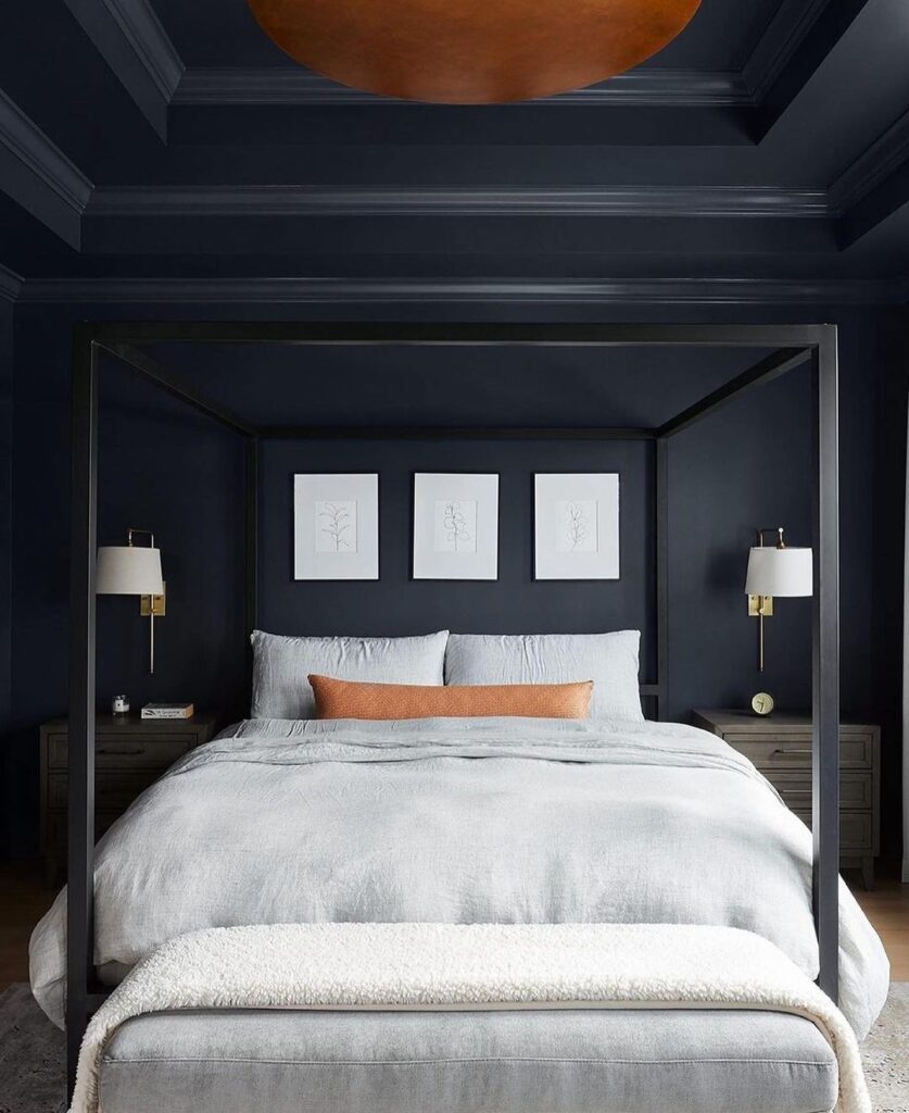 Navy bedroom, four-poster bed, white accents