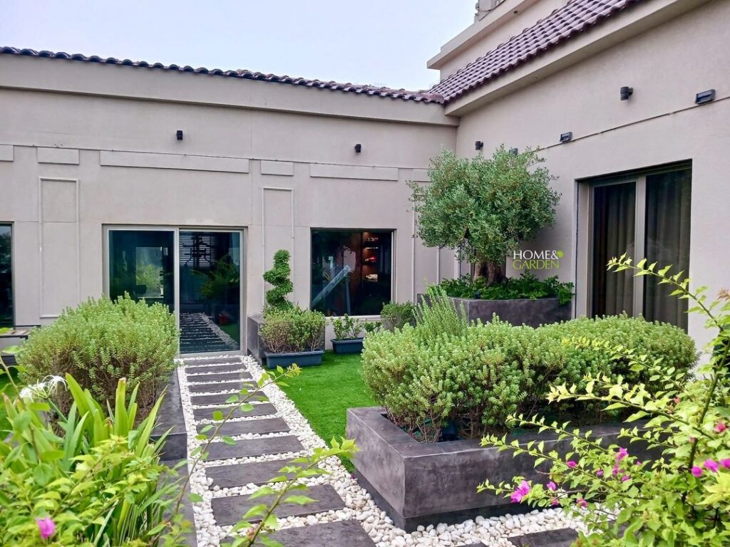 Modern courtyard with pavers and planters