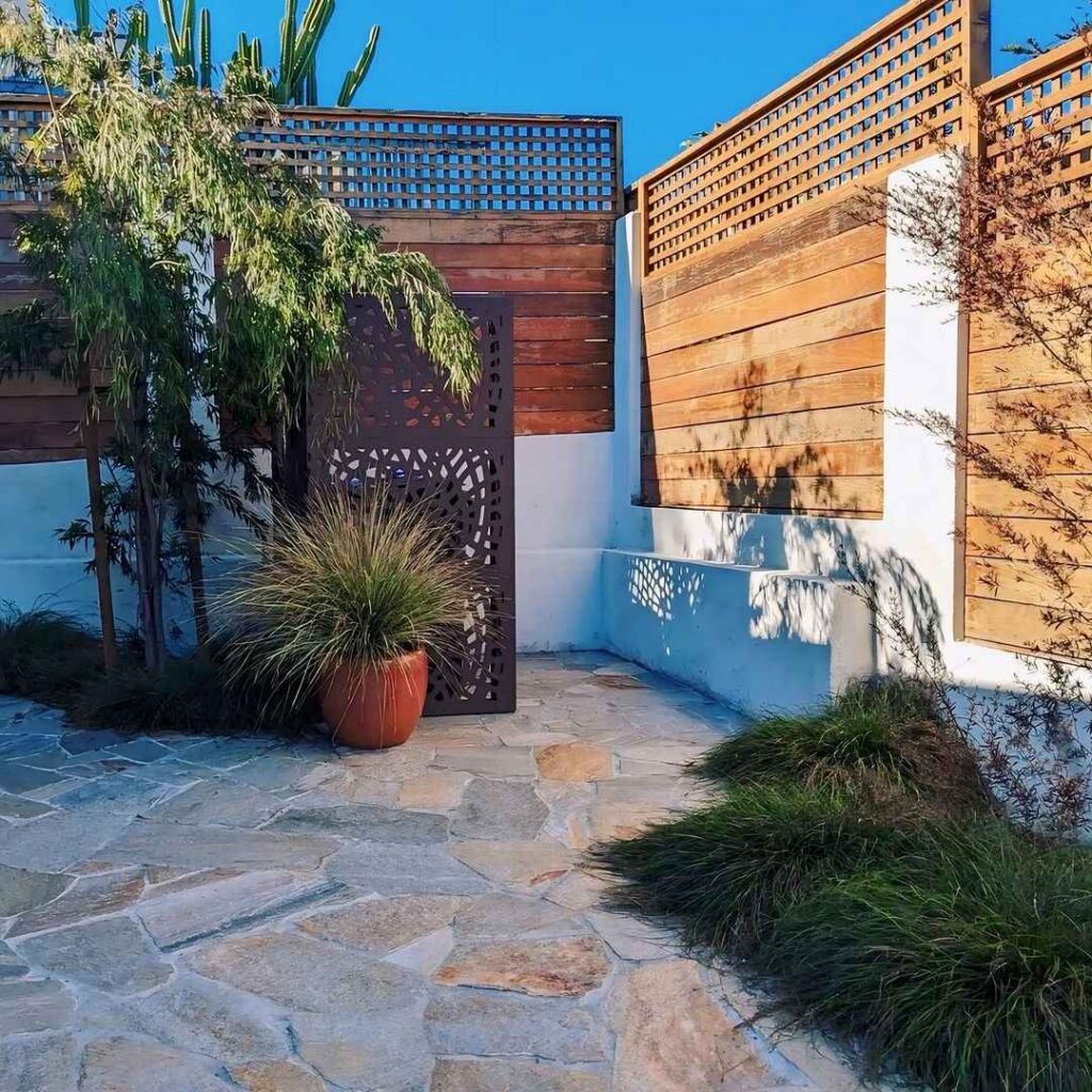 Modern courtyard with wooden fences and desert plants