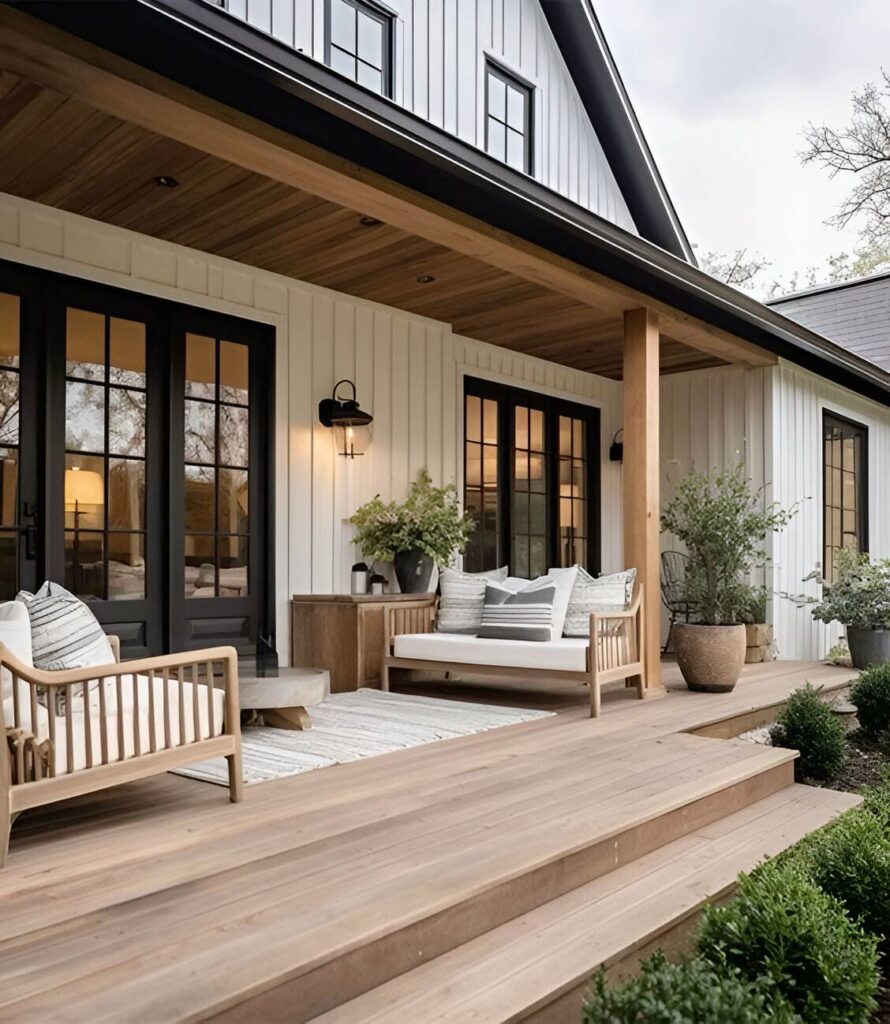 Modern farmhouse porch with wooden furniture