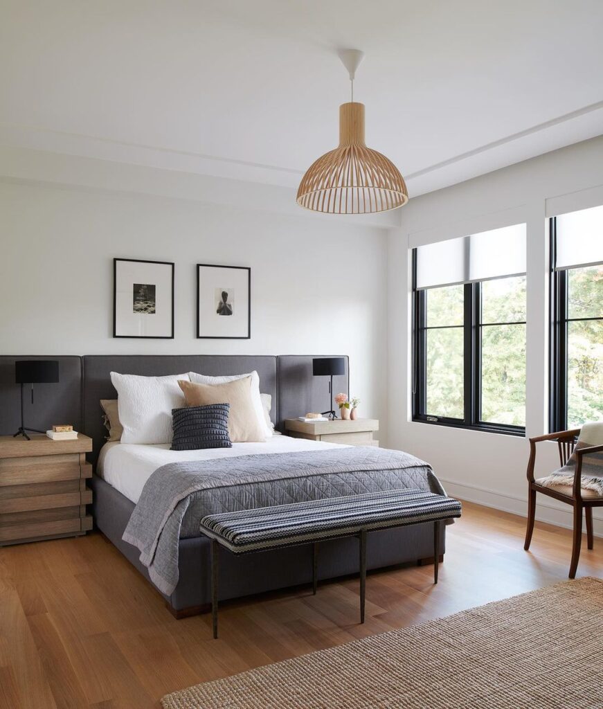 Minimalist bedroom, dark bed, pendant light