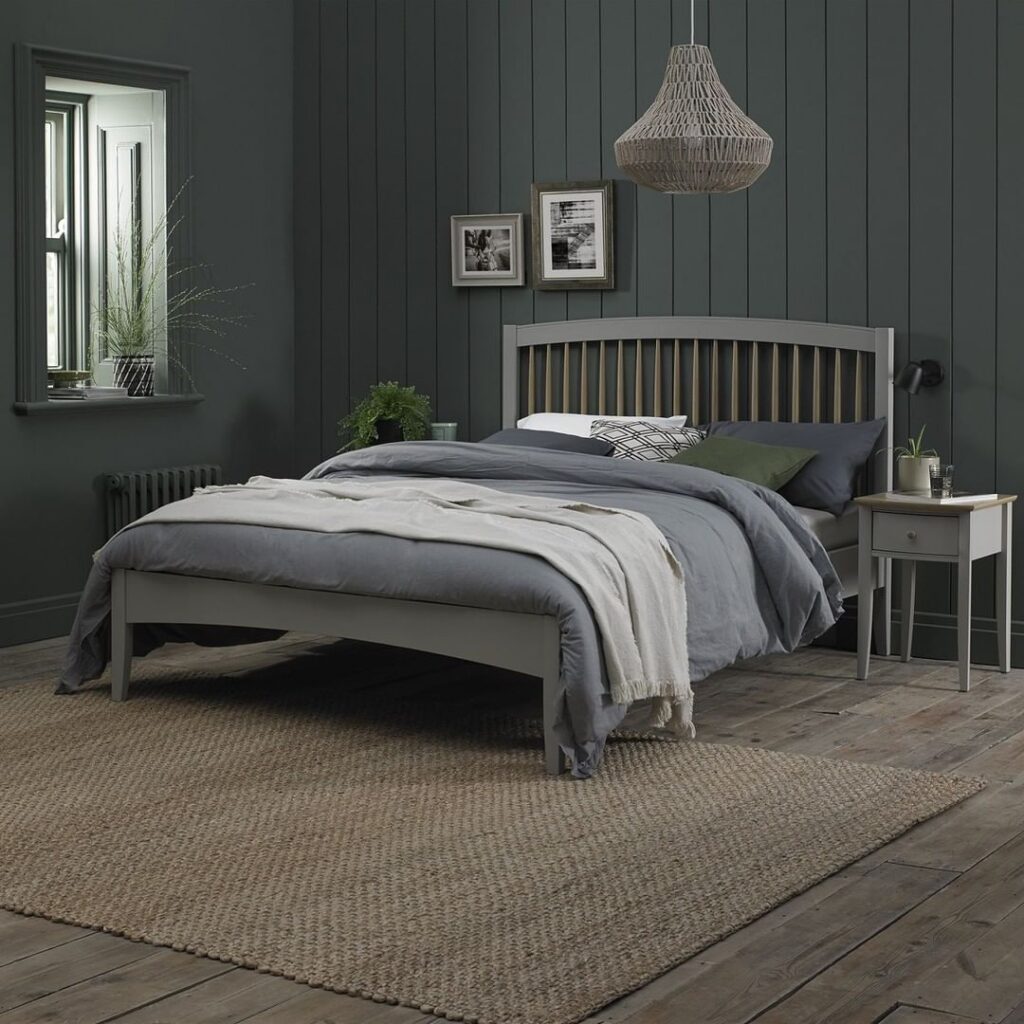 Dark green bedroom with gray bed