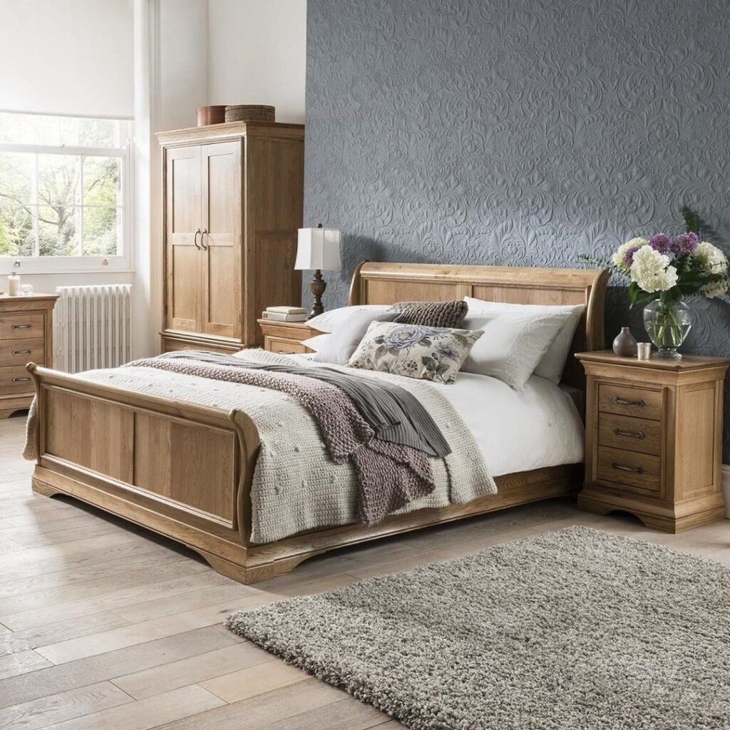 Oak bedroom set, textured blue wall, rustic elegance