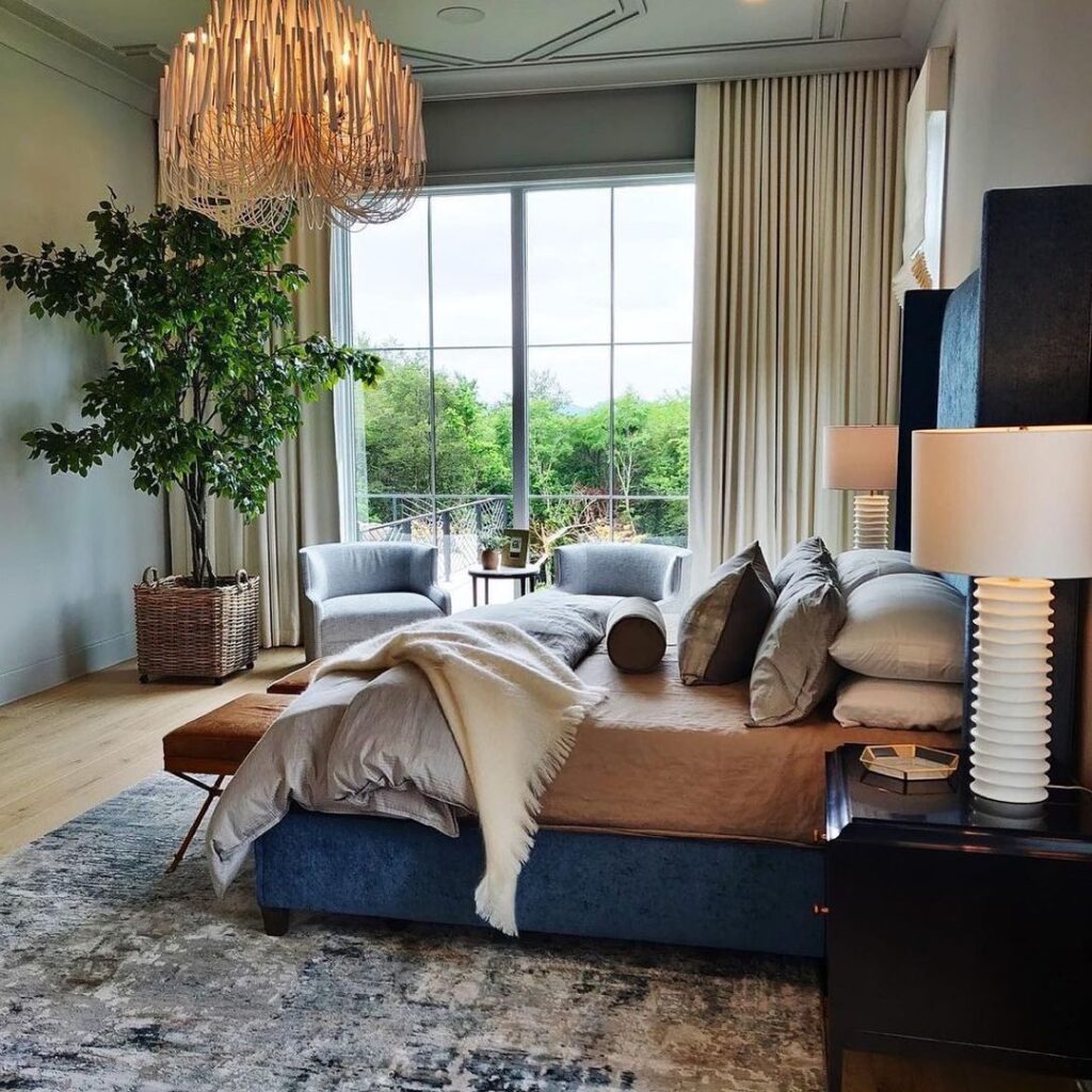 Blue bedroom, organic chandelier, nature view