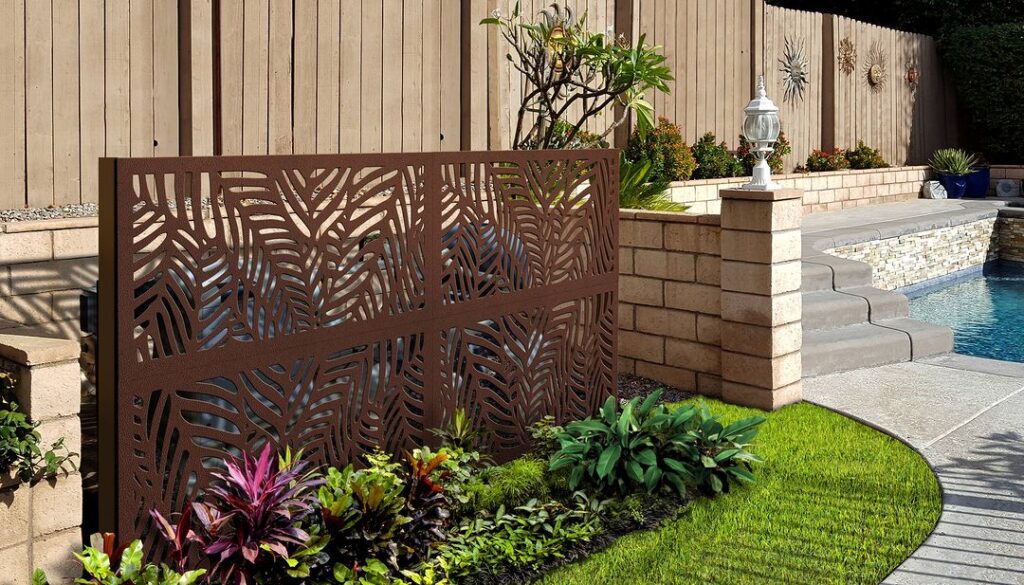 Decorative palm-patterned screen beside pool garden