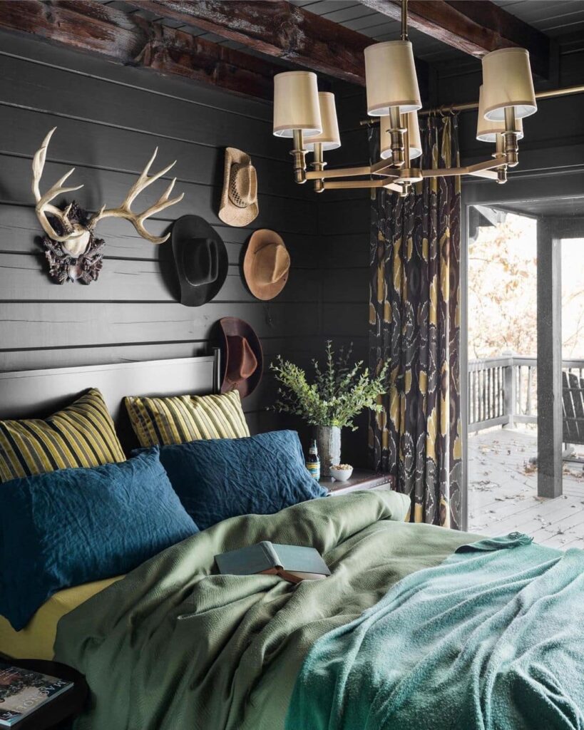 Blue bedding, dark walls, rustic decor