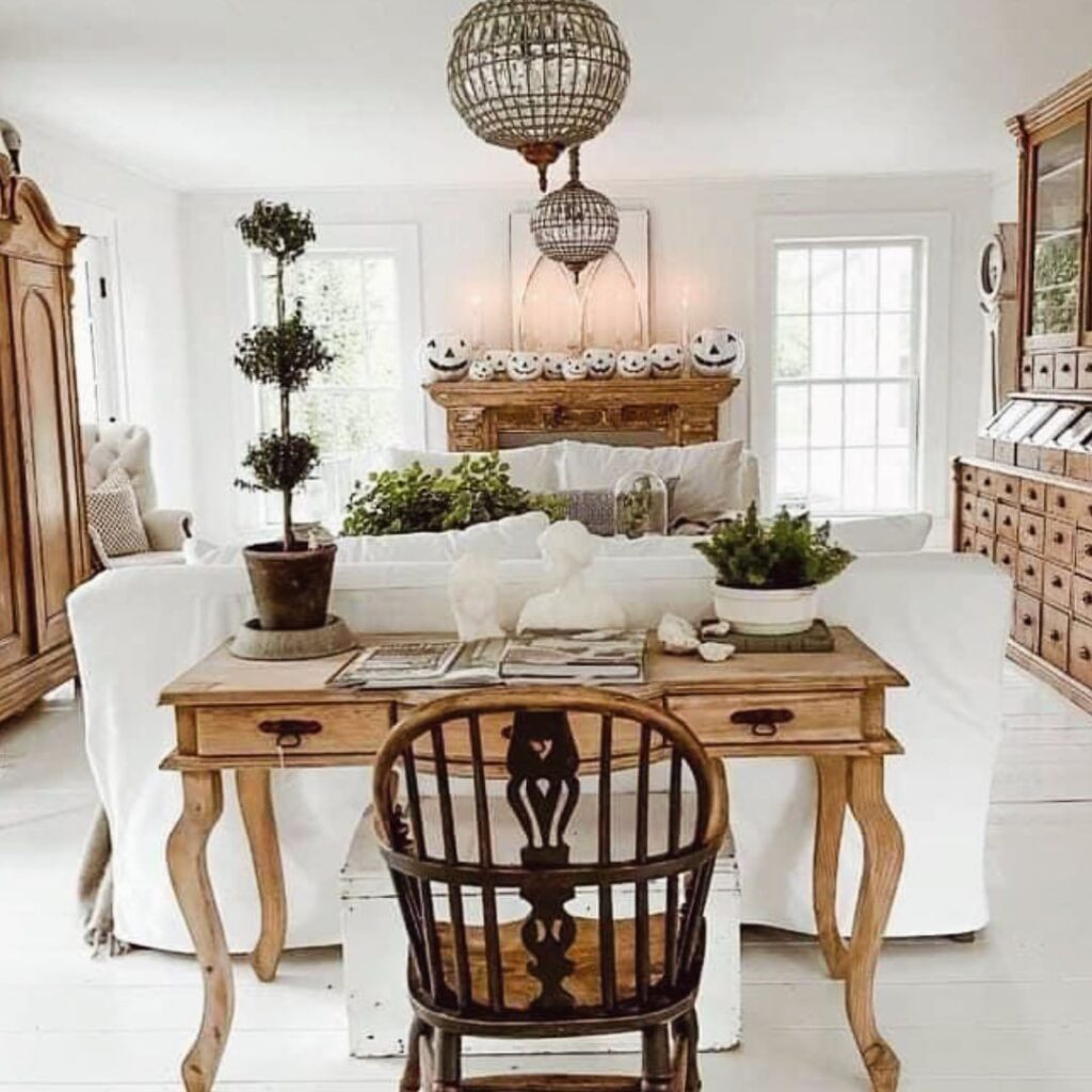 White rustic lobby, Halloween pumpkins, plants