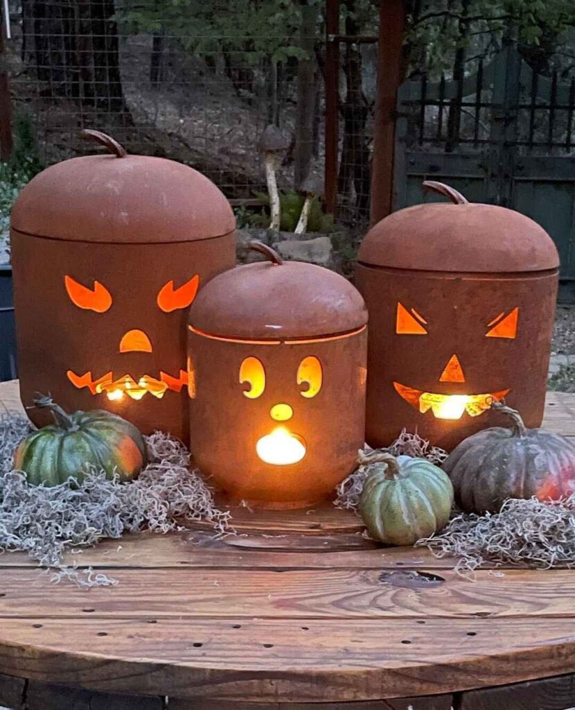 Illuminated metal pumpkins with real pumpkins