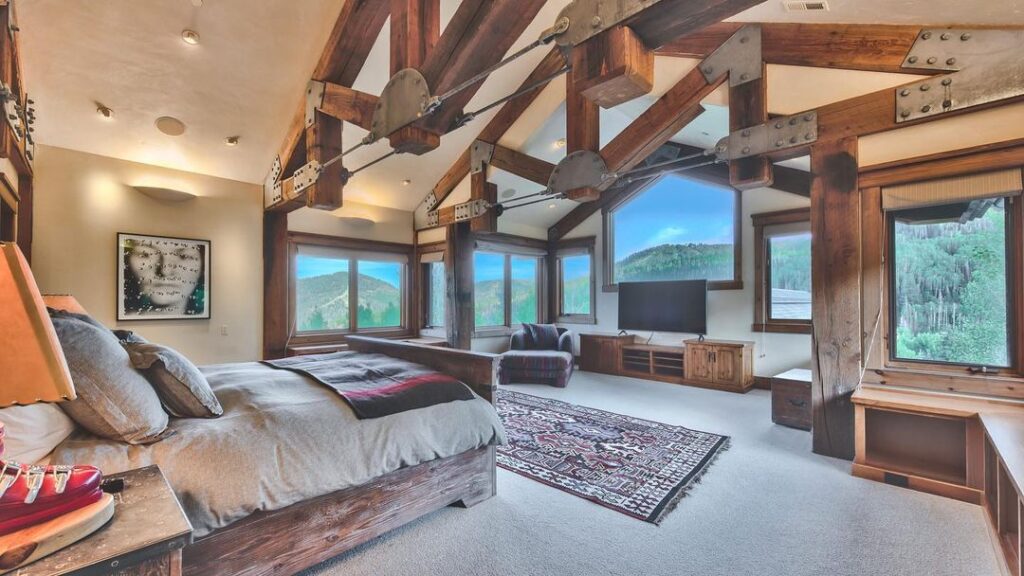 Wooden beam bedroom with mountain views