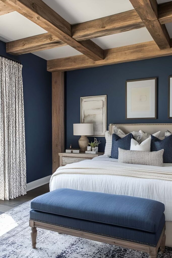 Navy walls, wooden beams, elegant bedding