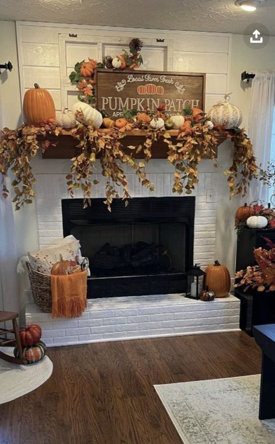 Fireplace decorated with pumpkins and fall foliage