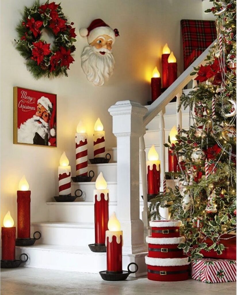 Christmas-decorated staircase with lighted candles and Santa decor