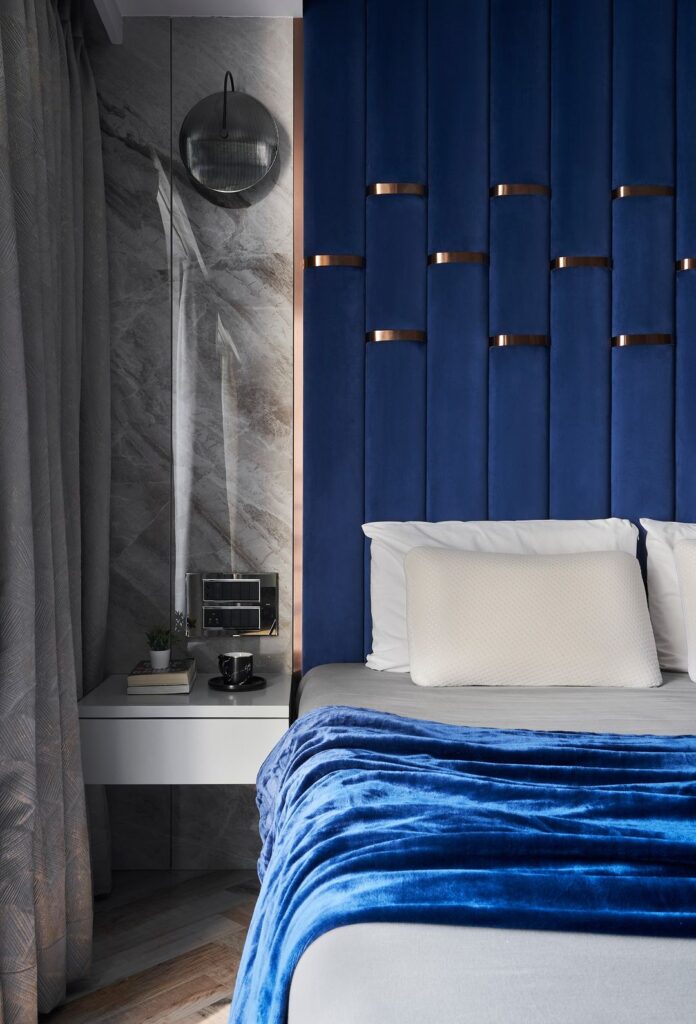 Modern blue bedroom with marble accent