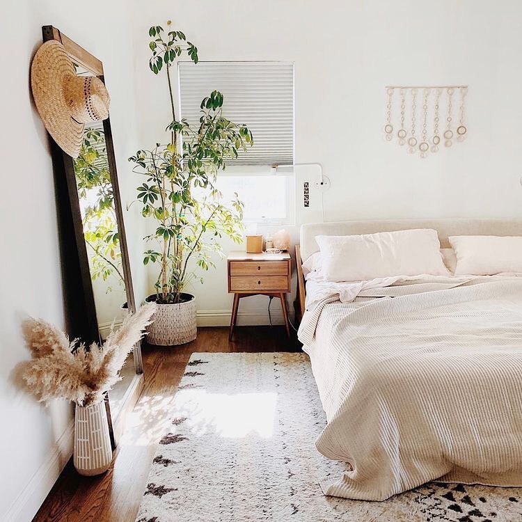 Minimalist boho bedroom, mirror, plants, neutral tones