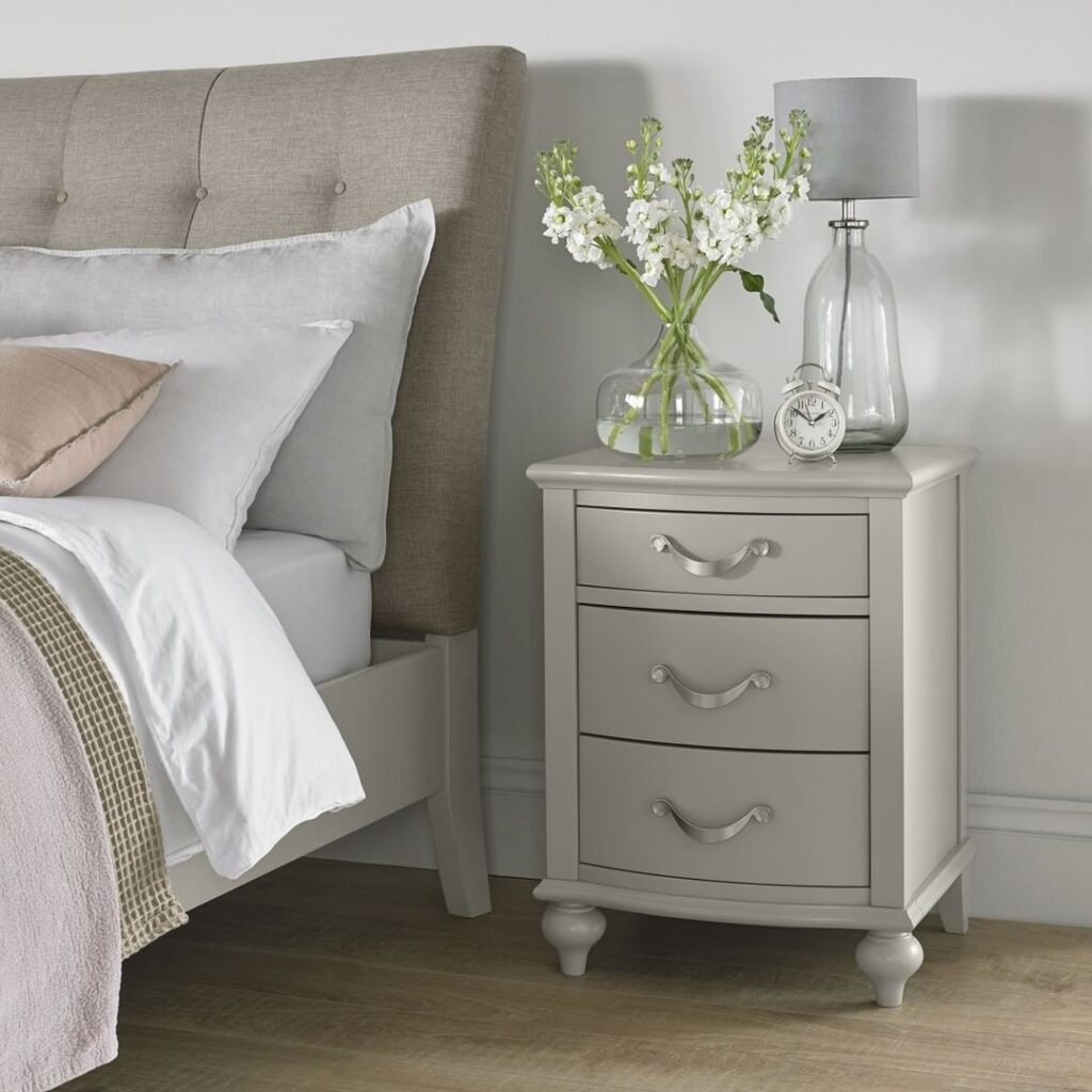 Gray bedroom corner with floral accents