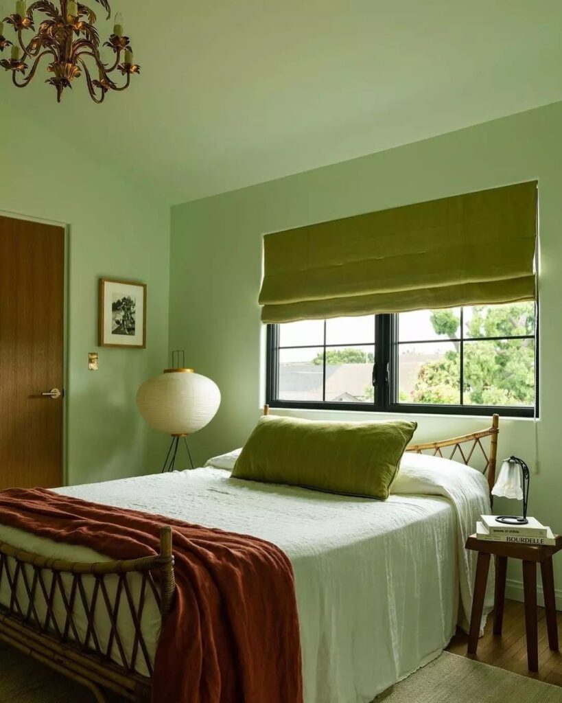 Green bedroom, rattan bed, vintage-inspired decor